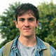 A headshot of Luca outdoors