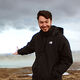 Adam Harris stood by a lagoon.