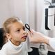 A child having their eyes examined