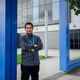 Photograph of Aiman outside the General Electric Renewable Energy offices during his industrial placement year