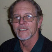 A portrait shot of retired lecturer George Botterill.