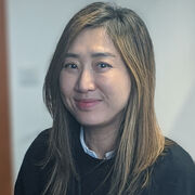 Gil Kook-Hee sitting at desk