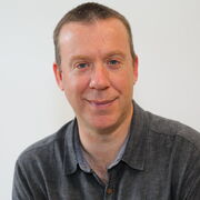 A profile photograph of Mark Bradley. 