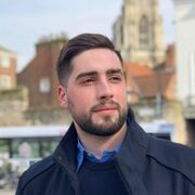 A man wearing a dark blue coat