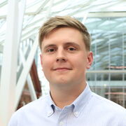 Man with blonde hair and white shirt