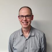 Headshot of Prof Ed Rhodes