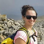 A photo showing Maud van Soest stood outside against a rocky landscape. 