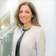 Maria-Teresa Speziale wearing a white blazer and black top.