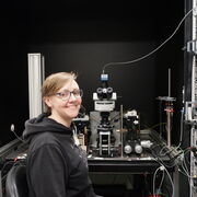 Image of Dr Katherine Wood sat with some equipment