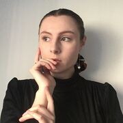 Ann Thompson holds her face in a pose