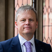 Portrait of a person in front of Firth Court windows