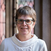 Portrait of a person wearing glasses and smiling