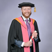 Researcher in his graduation gowns