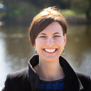 Head and shoulders image of Katherine Halewood in front of a lake