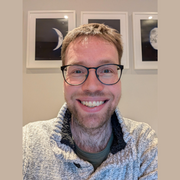 Headshot of Jim Taylor on a beige background