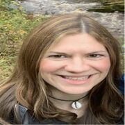 Siobhan Taylor smiling outside with a river in the background