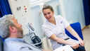 Student nurse with patient