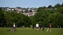 Members of the public enjoy the sunshine in Central Park on May 16, 2020 in Plymouth, England