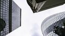 A view looking up at three skyscrapers