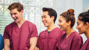 Dental students laugh in conversation