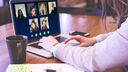 Person in front of a screen running video conference software