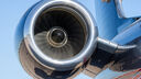 The engine of an aircraft below the wing, seen from the front