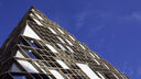 A blue sky above the University's Diamond building