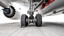 A photo of airplane wheels on a runway