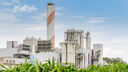 A carbon capture plant with grass in the foreground