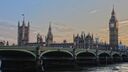 A photograph of the River Thames running alongside the Houses of Parliament.