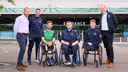 Conn Nagle with his wheelchair basketball team at Belfast City Airport.