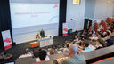 Professor Jim Wild addressing the audience in the auditorium