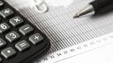 Image of a calculator and pen