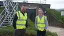 Two men in yellow high-vis jackets