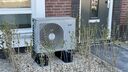 A heat pump in someone's garden.