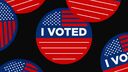 Red and blue stickers with the USA flag and the text 'I Voted'