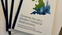 Physical copies of the white paper, featuring a leaf in the shape of the UK