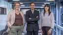 Three researchers posing for a photograph 