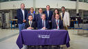Group of dignitaries behind a table 