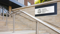 Management School sign outside by steps
