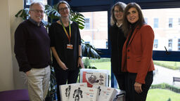 Robotics kit and staff members 