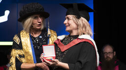 Chancellor Lady Justice Rafferty presenting Lucie Cave with her award
