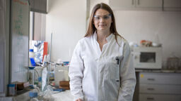 Chemistry PhD student in lab coat