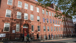 People walking by the Amy Johnson building - image 