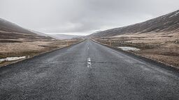A photograph of a road disappearing into the horizon to symbolise long-term planning.