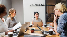 Office workers in a meeting.