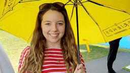 A profile photo of Jessica Williams with an umbrella.
