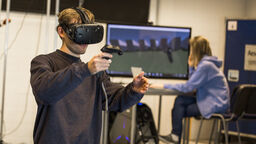 students testing out virtual reality in the lab