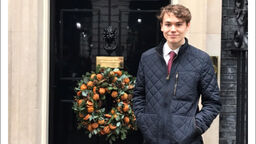 Politics graduate, Jack, is pictured stood outside of 10 Downing Street.