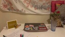 Home desk set up with laptop, pen and paper